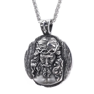 Silver St. Benedict Jesus medal necklace with detailed engraving on twisted rope chain