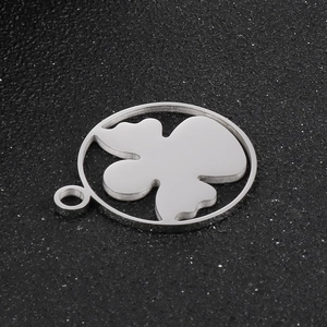 Close-up of silver stainless steel cartoon angel pendant with abstract cloud pattern