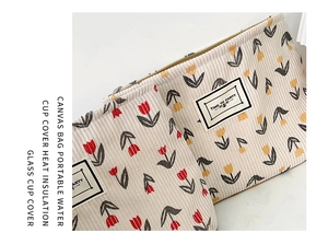 Detail of corduroy pouch with tulip pattern and 'TIME TO PARTY' label on a white background