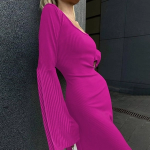 Detail of rose purple ribbed knit maxi dress showing long flared sleeves and slim fit