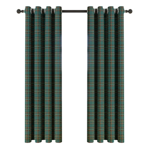 Classic green plaid Christmas curtains with snowflake pompoms on a metal rod