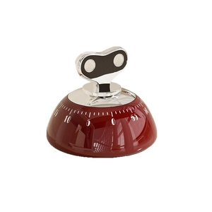 Mechanical red kitchen timer with chrome knob and 60-minute dial on white background