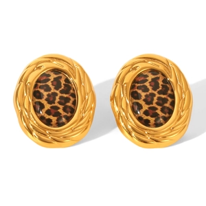Detail of vintage 18k gold oval earrings with leopard print and twisted rope edges