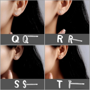 Detailed close-up of S999 sterling silver letter studs featuring Q, R, S, and T designs