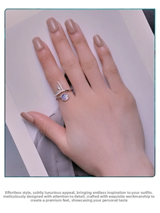 Detail of s925 silver fishtail ring with sparkling crystals and purple opal gemstone