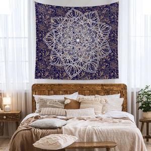 Detailed Bohemian navy tapestry with golden paisley and white mandala in bedroom