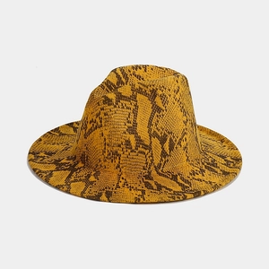 Macro detail of ginger yellow snake skin pattern wool fedora with wide brim flat brimmed hat