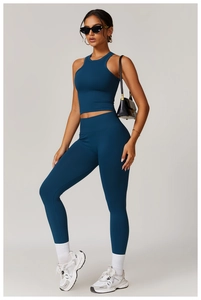 Detailed view of high waist yoga leggings and crop top with ribbed texture in navy blue