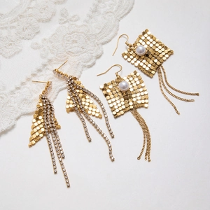 Detail of 18K gold stainless steel fringe earrings with cubic zirconia and pearls