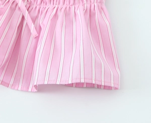 Detailed macro view of pink and white striped poplin shorts with elastic drawstring waist