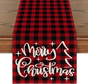 Close-up of red and black buffalo plaid Christmas table runner with Merry Christmas print