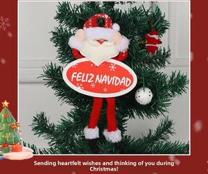 Detailed Santa Claus hanging ornament with Feliz Navidad sign on a Christmas tree branch
