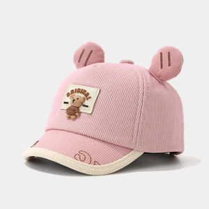 Detail of pink corduroy toddler baseball cap with cute bear ears and embroidery patch