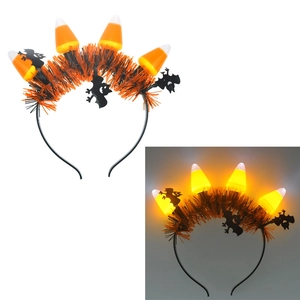 Day and night comparison of glowing Halloween headband with candy corn and bats