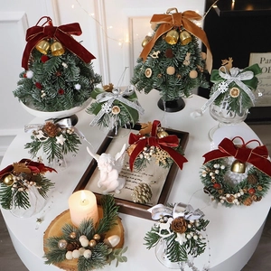 Mini Christmas tree set with red bells, wreaths, and velvet ribbons for holiday decor