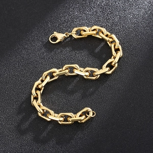Close-up of chunky gold-plated stainless steel chain bracelet with lobster clasp