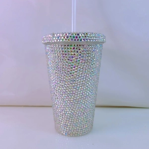 Detail showing high-density silver rhinestones on a double-wall straw tumbler