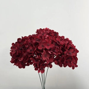 Detailed view of artificial dark red hydrangea stems with realistic floral textures