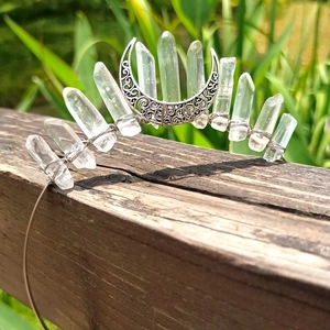 Detail of bohemian crown with raw white crystals and a crescent moon on silver wire