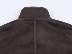 Detail shot of a dark brown jacket collar showing leather trim and high-quality stitching