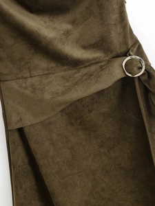 Detail of faux suede dress with olive green fabric and a round silver metal buckle