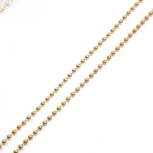 Detailed view of polished 18k gold plated ball chain necklace with smooth round beads
