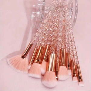 Detail of 10pcs makeup brushes with spiral glitter handles and pink gradient bristles