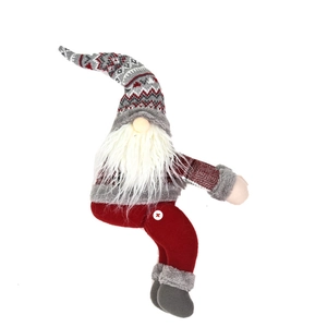 Christmas gnome doll with red flannel hat and grey knitted legs for holiday home decoration