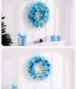 Close-up of blue and silver Christmas wreath with LED lights and ribbon decoration