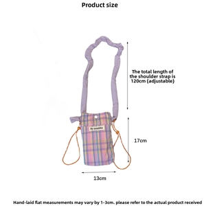 Detail view of pink plaid mini crossbody bag with purple scrunchie strap and dimensions