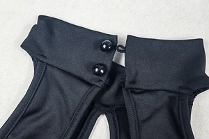 Detailed close-up of the black bodysuit back collar with dual button loop closures