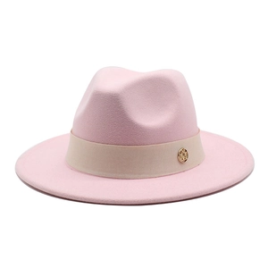 Classic pink wool fedora hat with beige ribbon and gold emblem for winter fashion