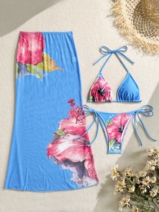 Macro detail of sky blue floral bikini set with matching semi-sheer mesh beach sarong