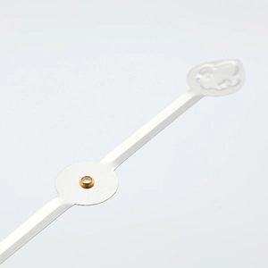 Silver aluminum clock hands with brass core, quartz clock accessories in macro view