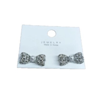 Elegant silver bow earrings with crystals and imitation pearl on jewelry display card