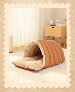 Cozy semi-enclosed cave pet bed with thick plush lining and warm brown quilted exterior