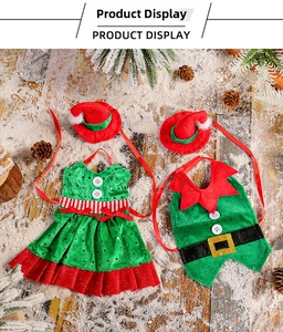 Detailed view of plush Christmas wine bottle cover set with Santa hats on wooden floor