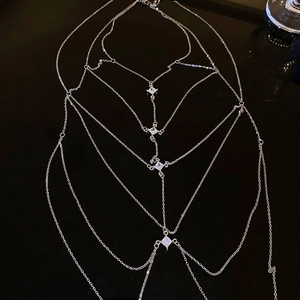 Detailed view of silver multilayer geometric body chain with square zircon crystals