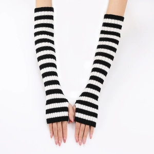Detail of long knit fingerless gloves with black and white horizontal stripes on arms