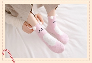 Detail of pink coral fleece sock featuring cute 3D cat ears and thick warm plush texture