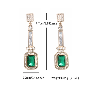 Detail view of emerald teardrop earrings with dimensions 4.7cm height and 1.2cm width