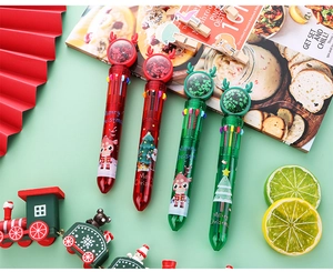 Detail of Christmas multi-color ballpens with reindeer sequin toppers and cartoon prints