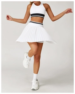 Dynamic view of white pleated tennis skirt showing motion and high-elasticity fabric