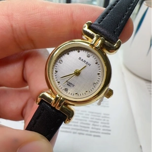 Barsh women's quartz watch with gold round case, silver diamond dial, and black leather strap