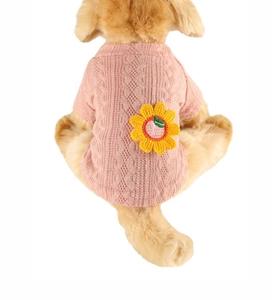 Close-up of pink knit dog sweater featuring a yellow sunflower patch on the back