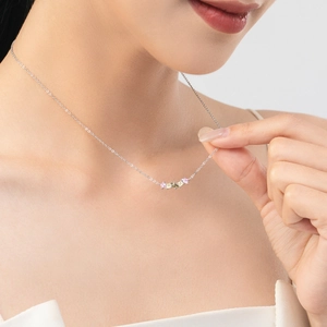 S925 sterling silver clavicle necklace with pink and yellow gemstones worn by a model