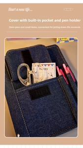 Detail of blue denim notebook cover featuring storage pocket, pen loops and velcro closure