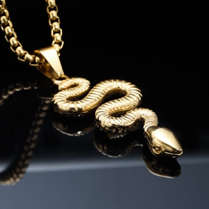 Gold coiled snake pendant necklace with square box chain in punk streetwear style