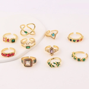 Detailed macro view of 18K gold plated adjustable rings with colorful zircon gemstones