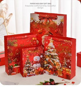 Detailed view of assorted Christmas gift bags with Santa and Snowman prints in four sizes
